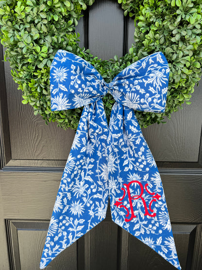 Blue and white block print wreath sash with contrast striped piping, monogram available