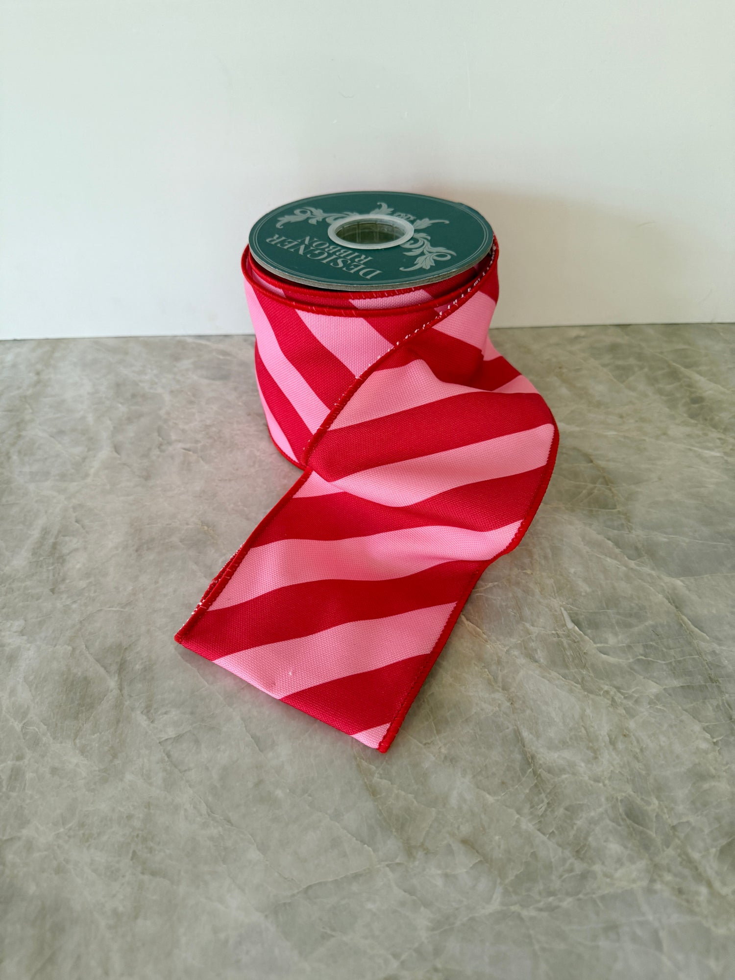 Pink and red diagonal striped ribbon by the roll, 4”x10 yards
