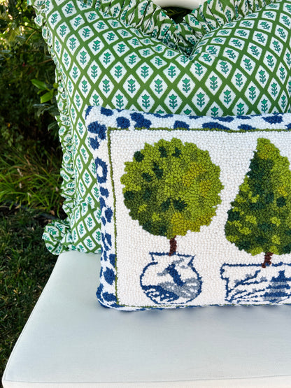 Topiaries, chinoiserie, and leopard hand hooked pillow