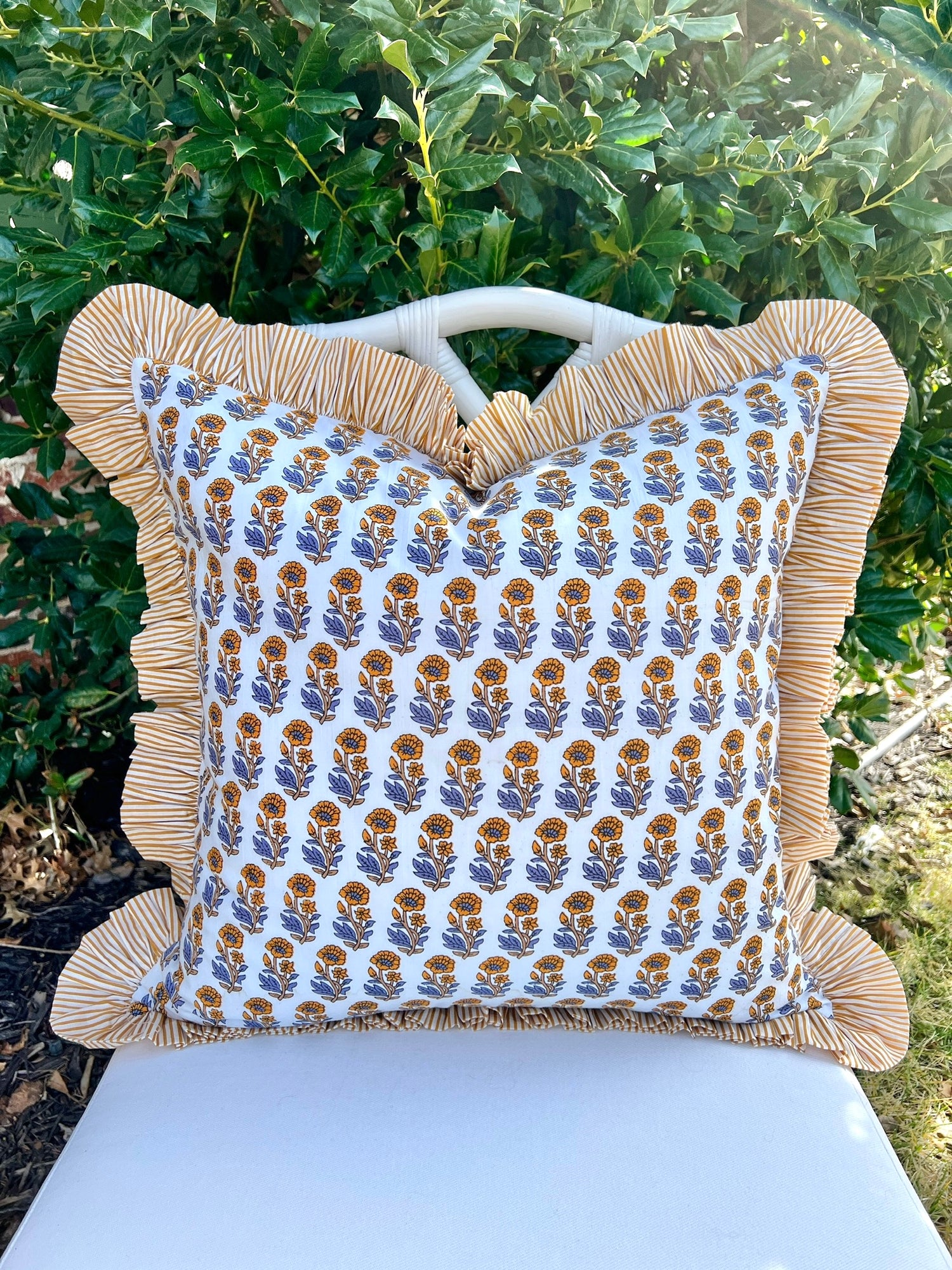Yellow and blue floral block print pillow cover with ruffle trim