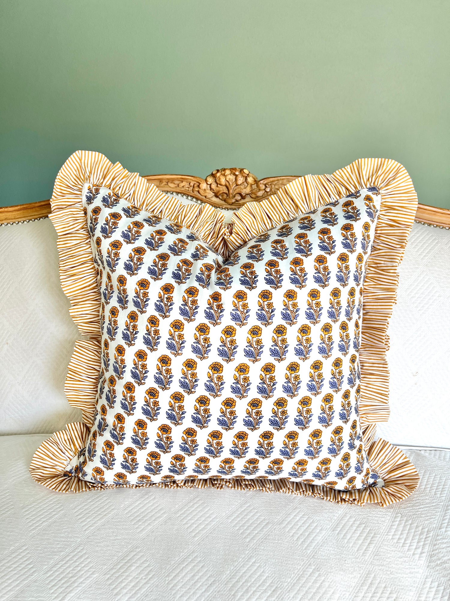 Yellow and blue floral block print pillow cover with ruffle trim