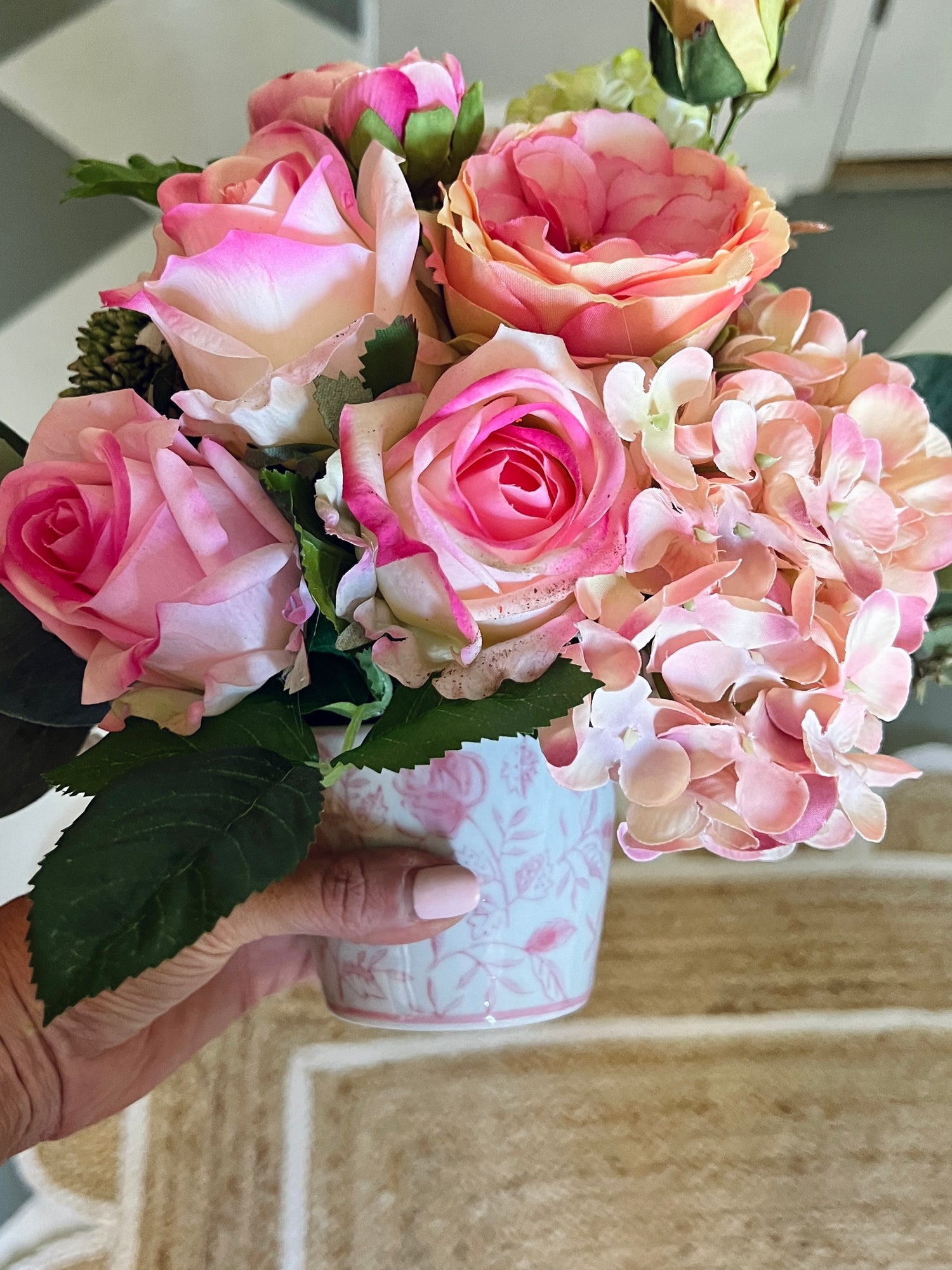 Petite faux floral arrangement, pink garden roses and hydrangeas in pink and white chinoiserie pot