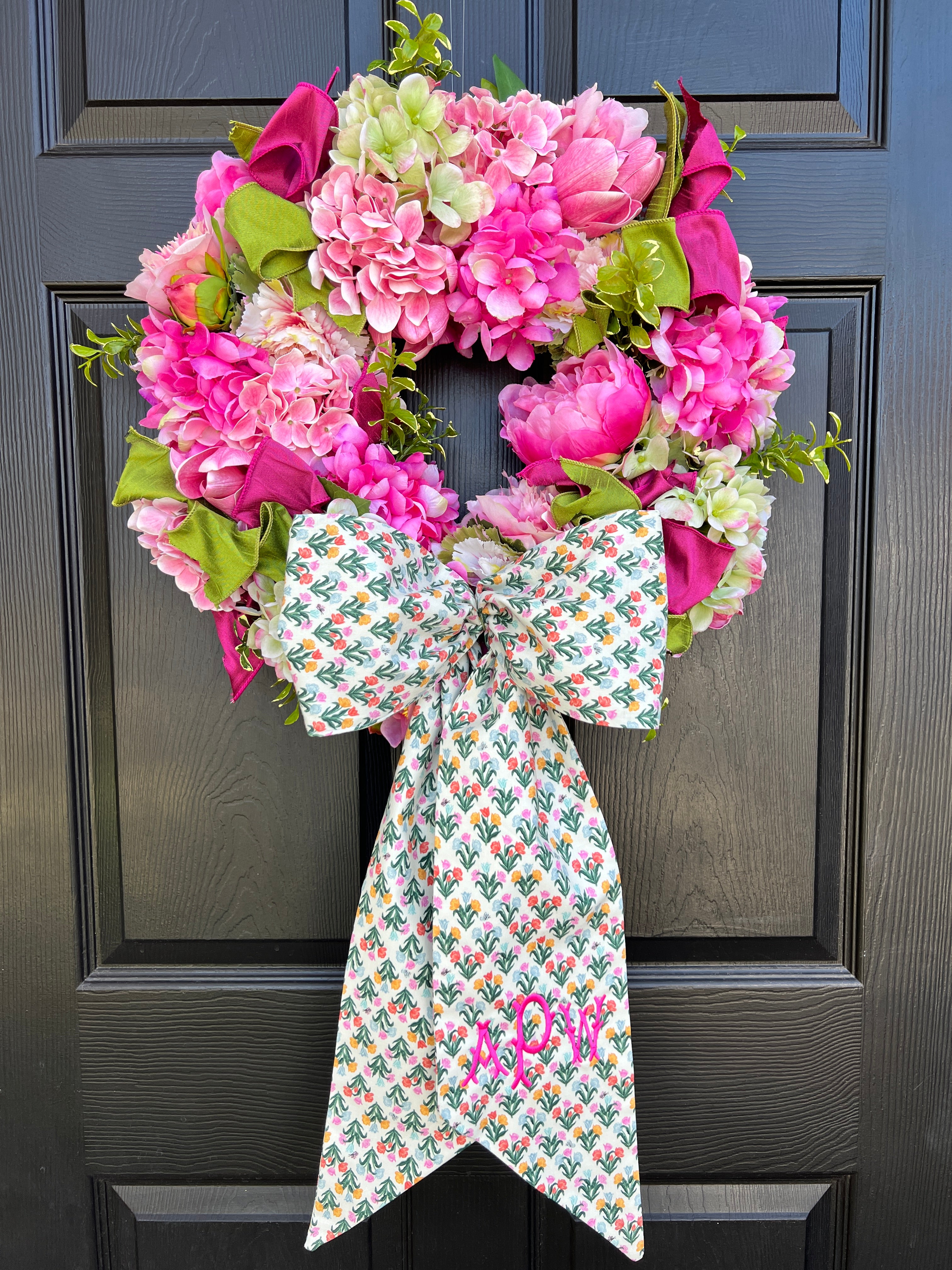 Spring pink and green hydrangea, peony, and cabbage wreath