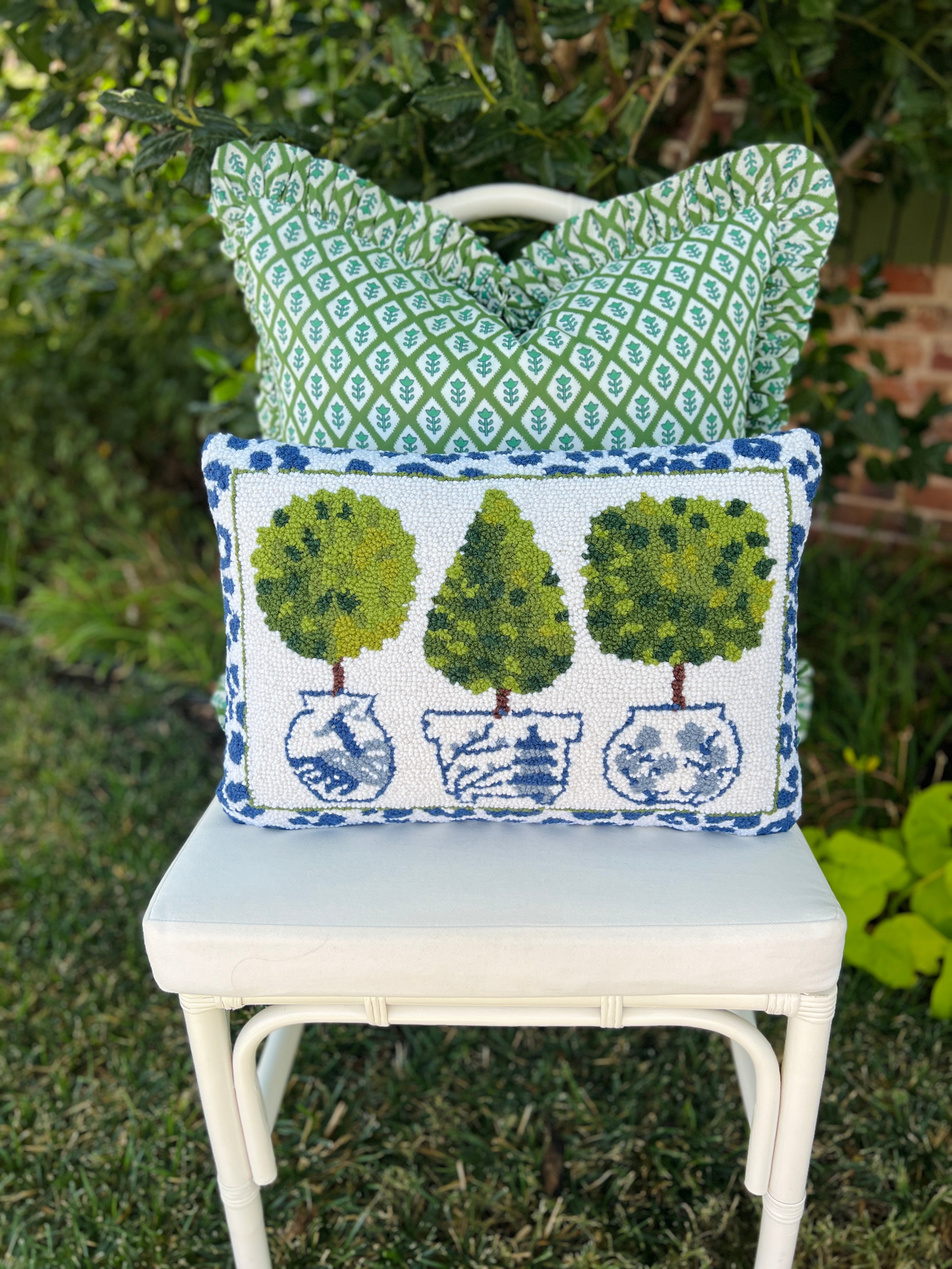 Topiaries, chinoiserie, and leopard hand hooked pillow