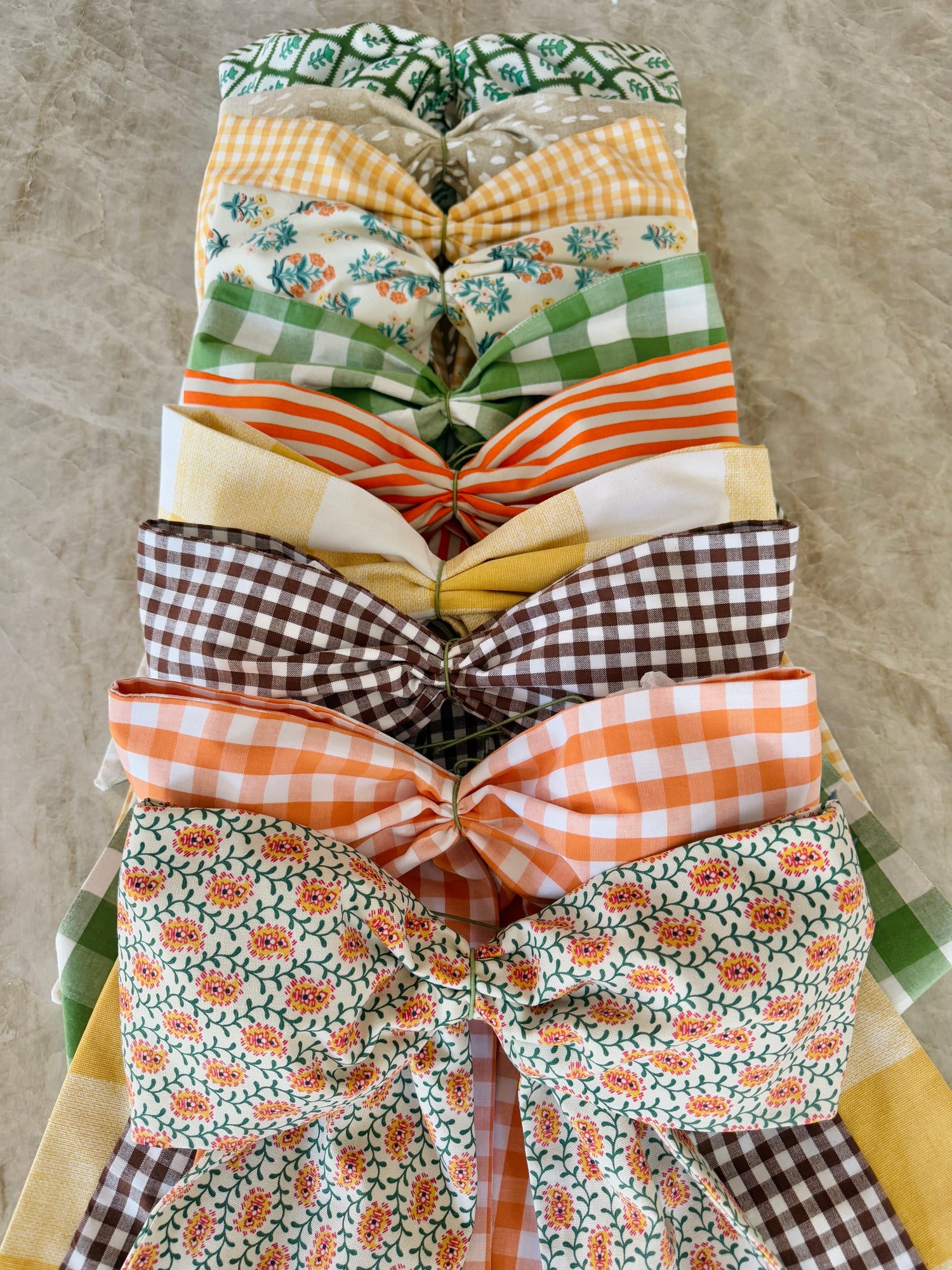 Green block print wreath sash with striped piping