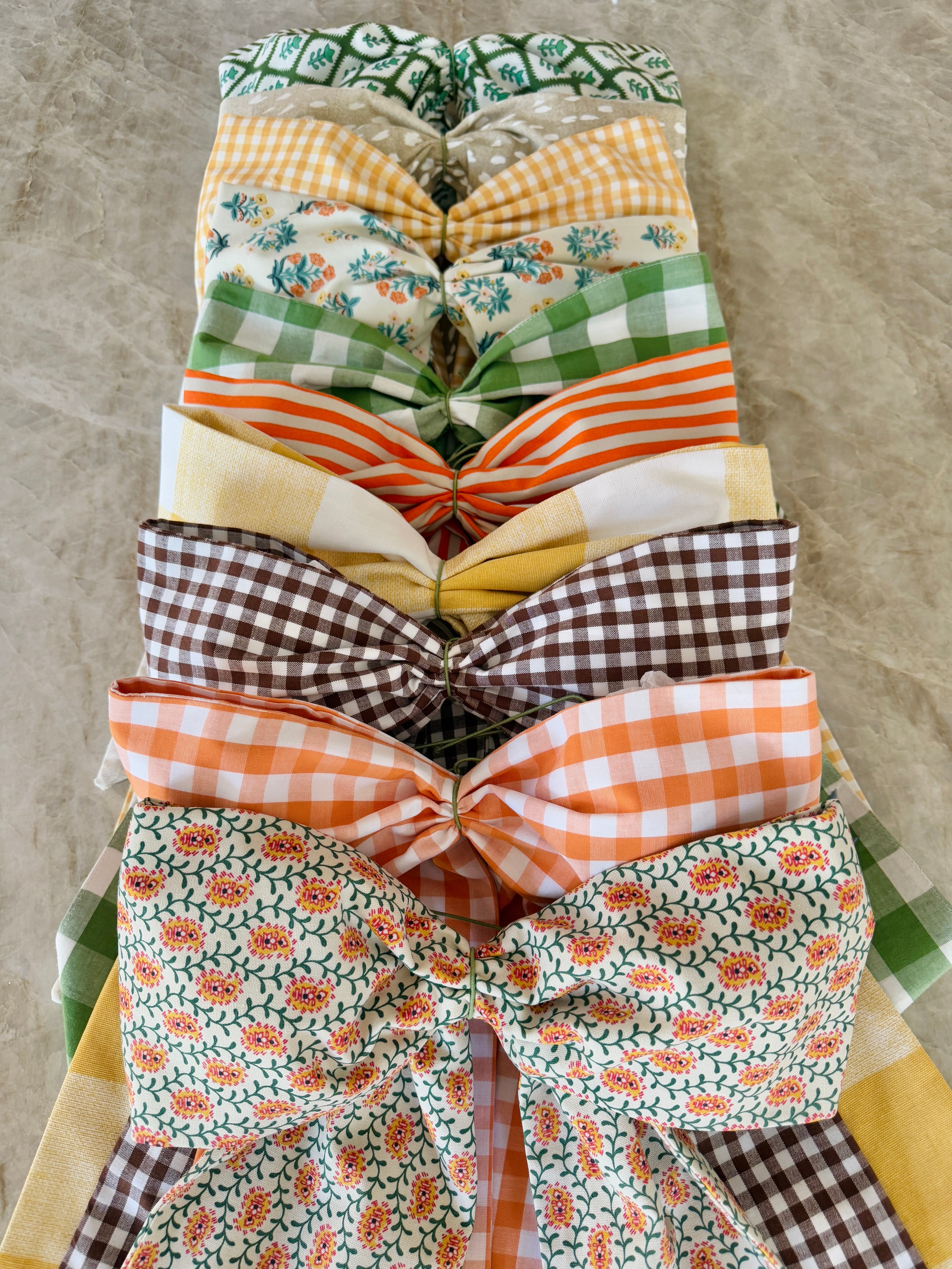 Green block print wreath sash with striped piping