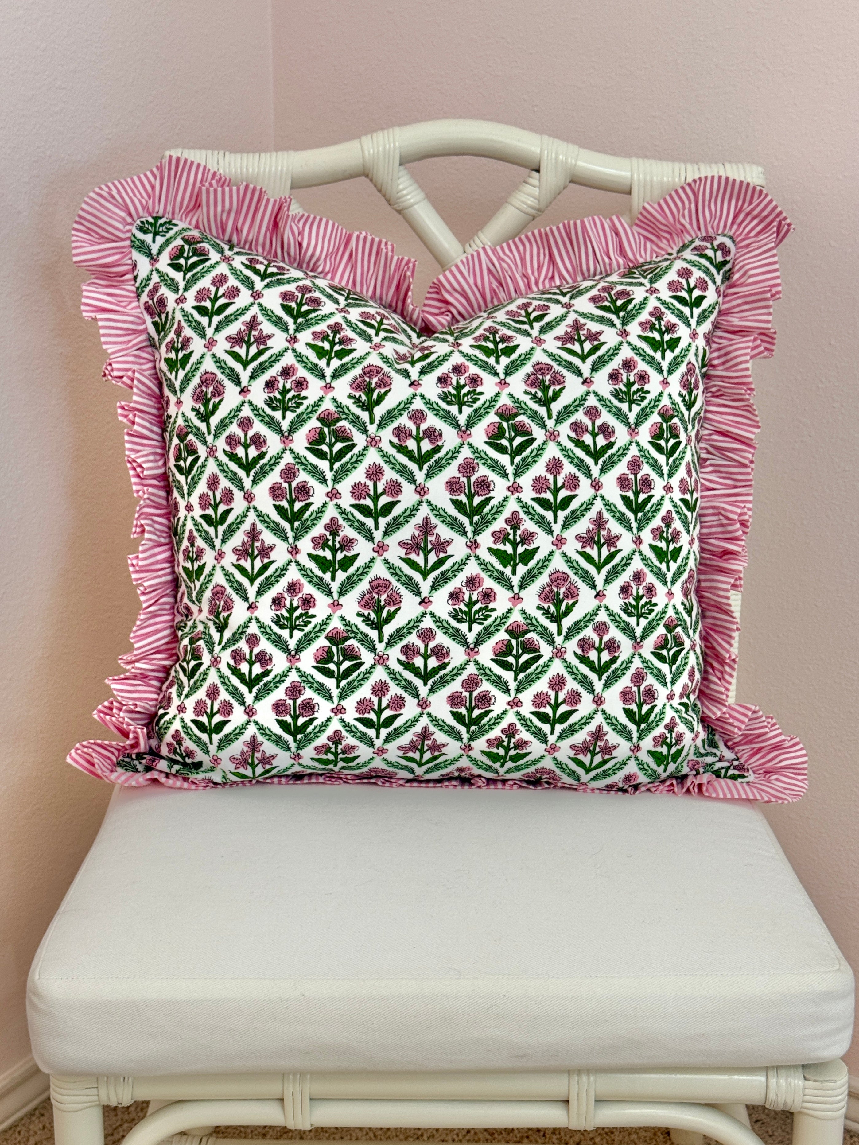 Pink and green floral trellis block print ruffle pillow cover with pink striped trim and back