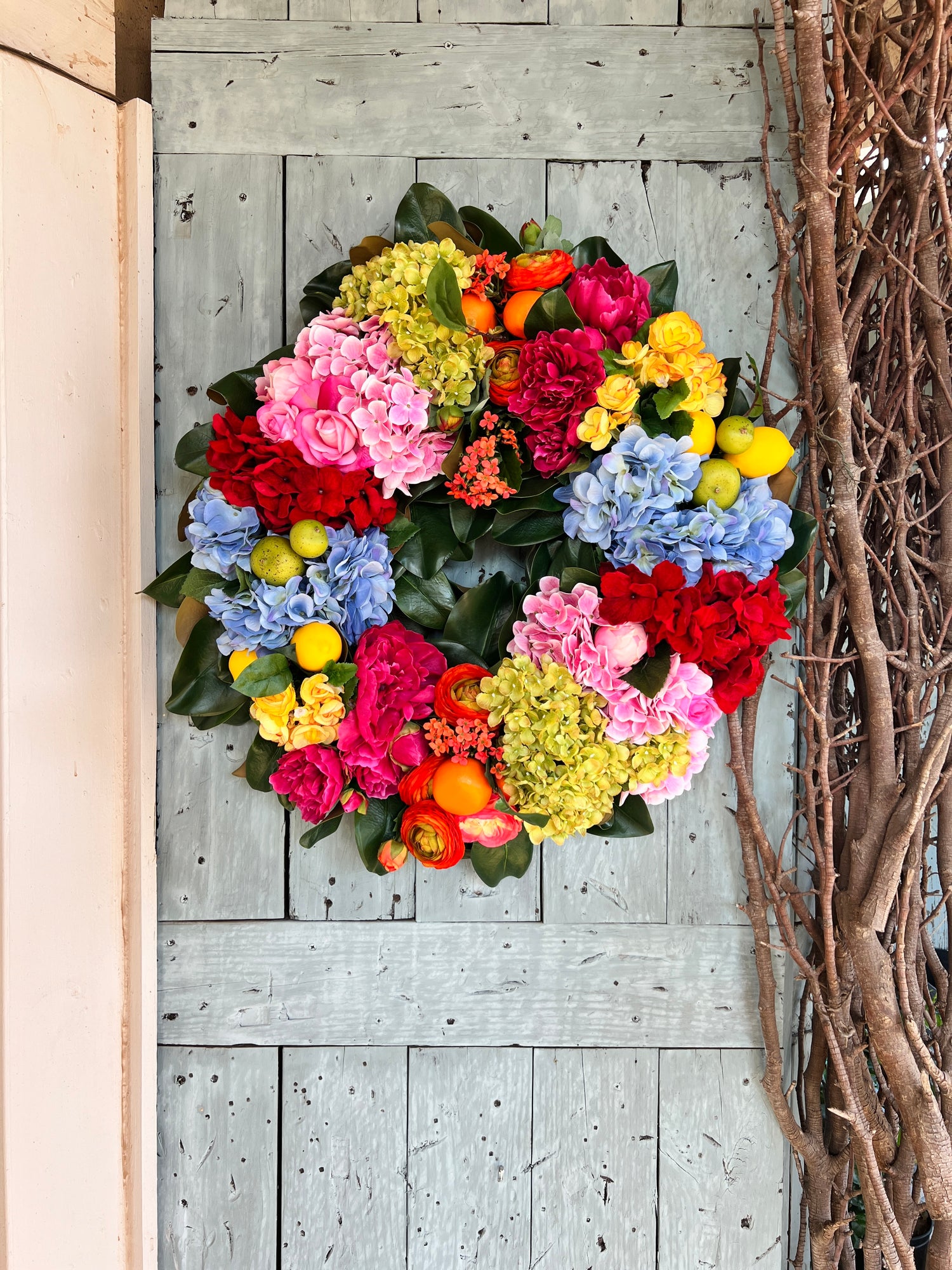 The “Mackie” bright, fabulous mixed floral wreath 30”