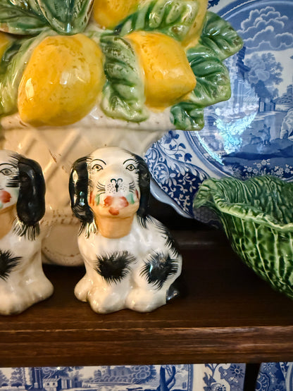 Mini black porcelain Staffordshire dogs with flower baskets figurine pair
