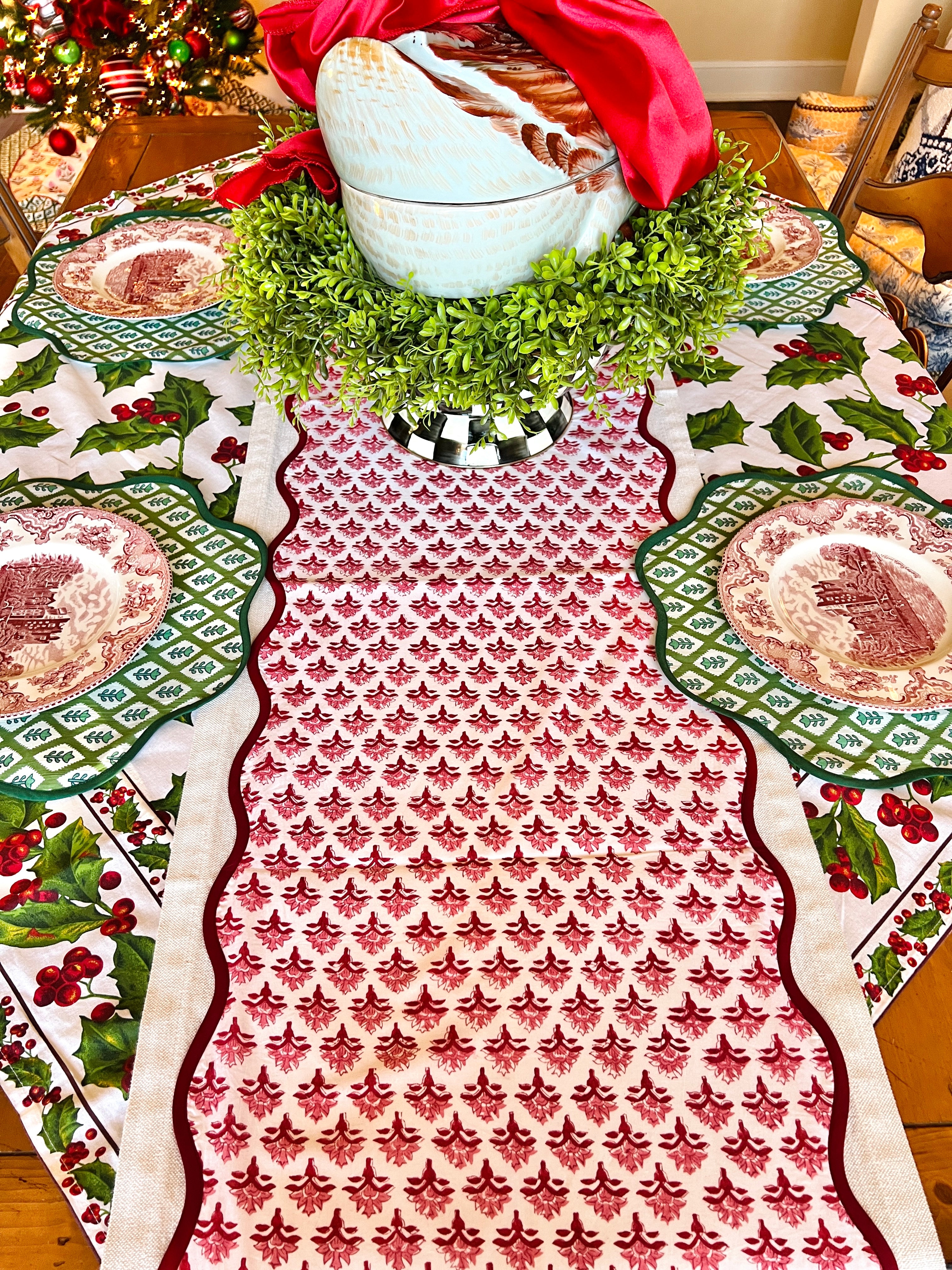 Red block print scalloped table runner with contrast piping