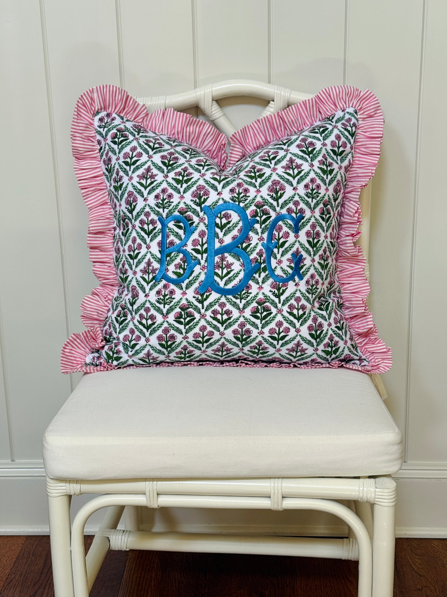 Pink and green floral trellis block print ruffle pillow cover with pink striped ruffle trim