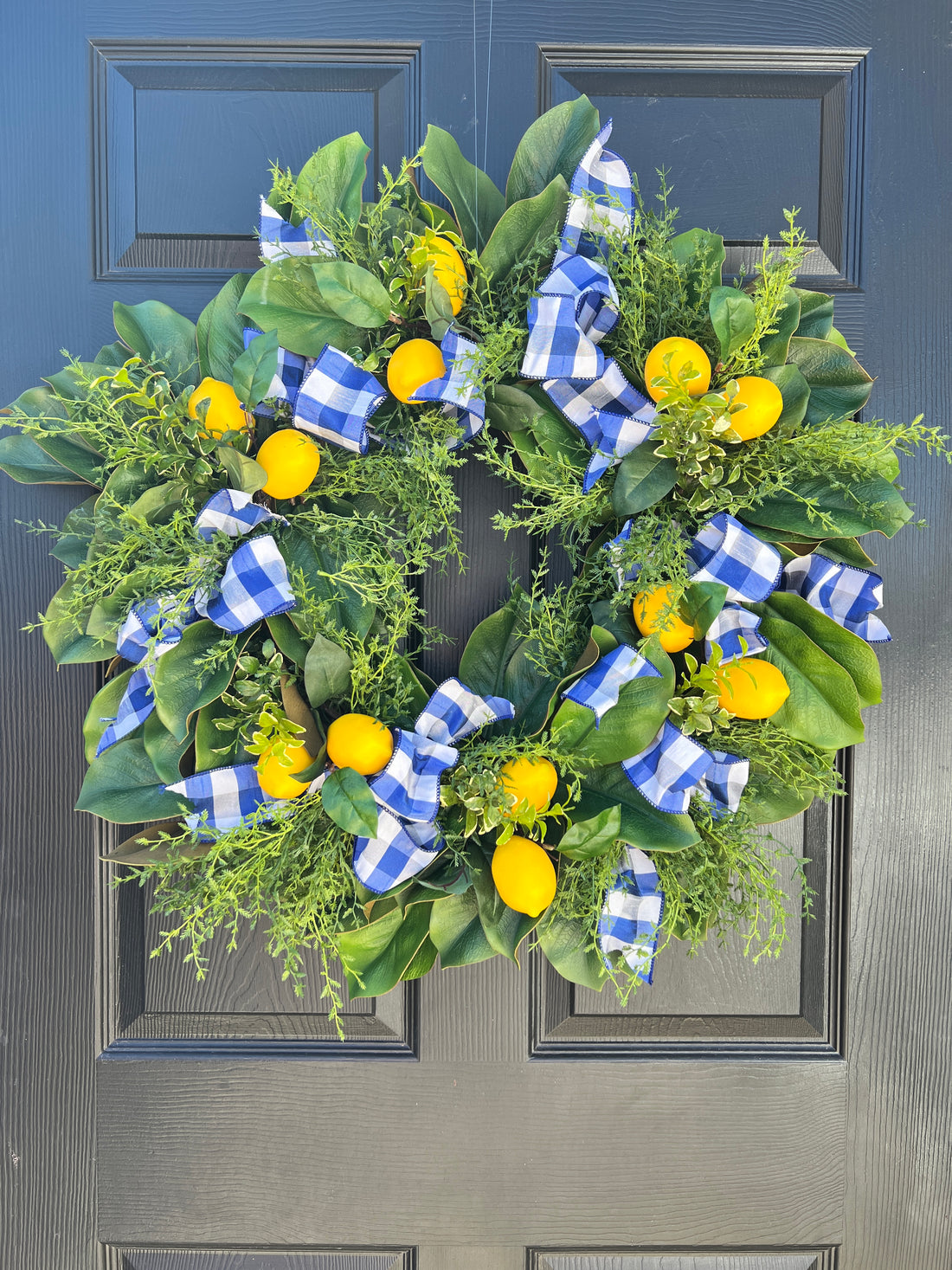 Lemon, herb, and magnolia wreath with blue gingham dupioni ribbon