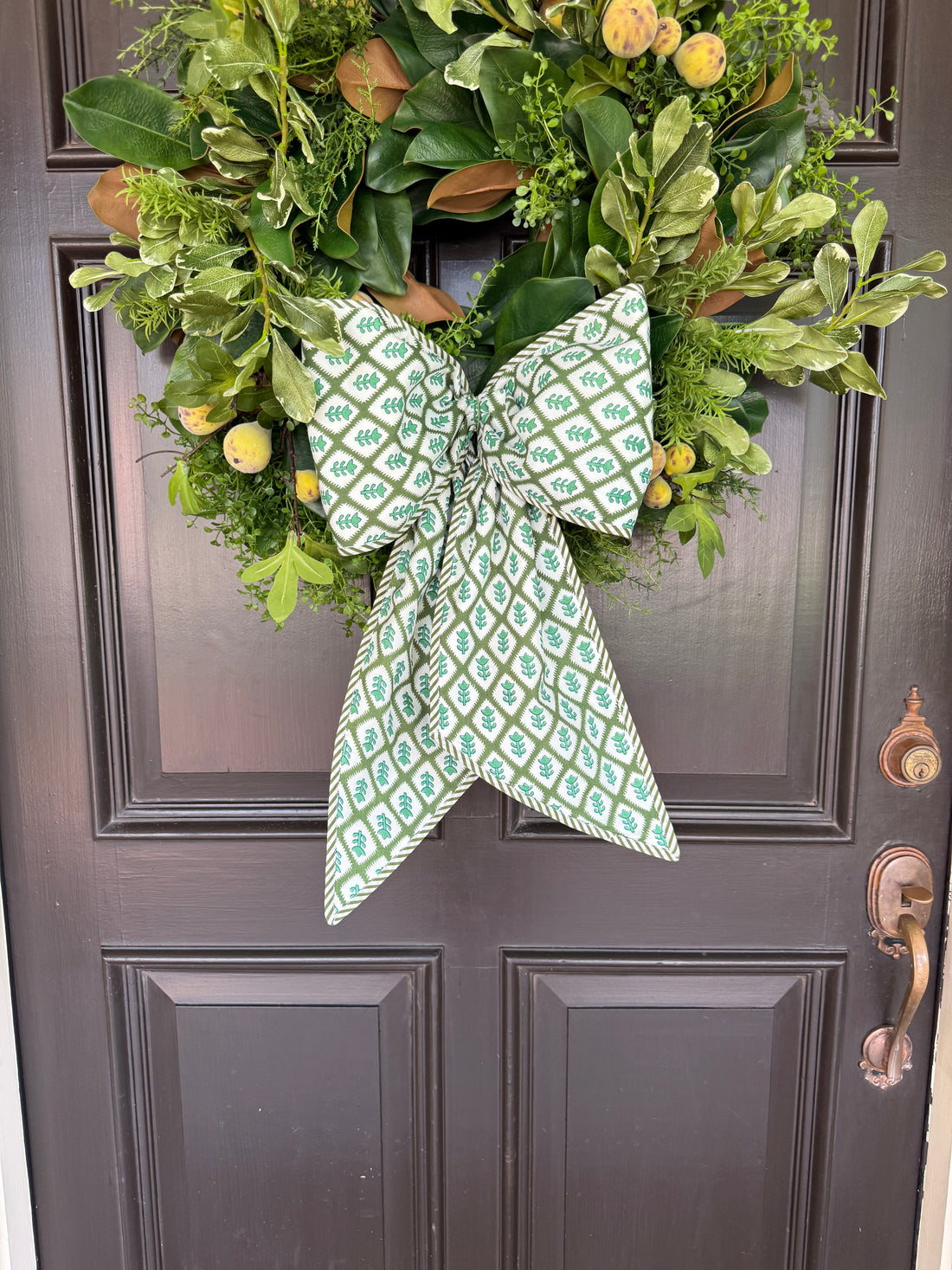 Green block print wreath sash with striped piping