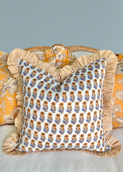 Yellow and blue floral block print pillow cover with ruffle trim