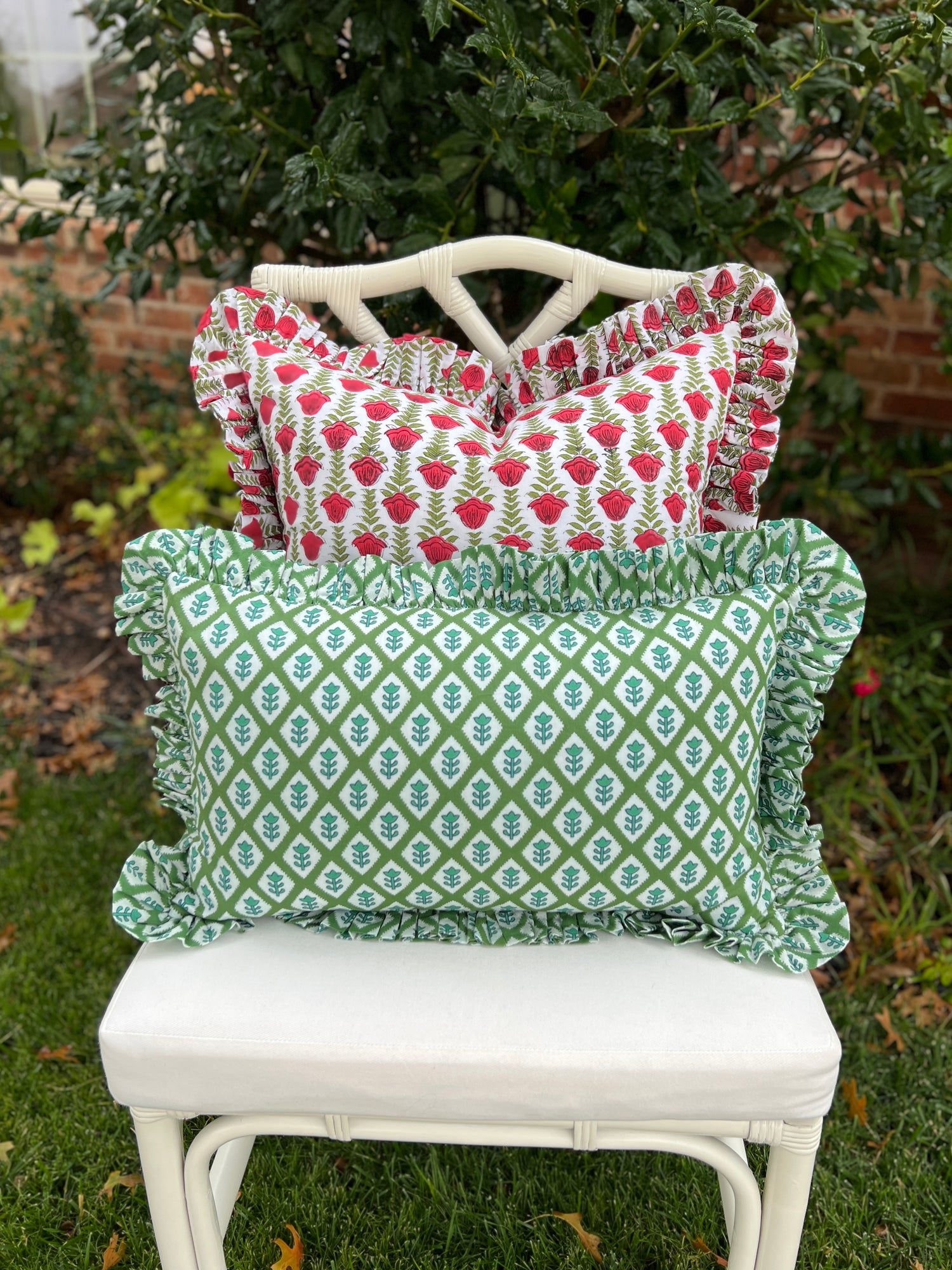 Red and green block print pillow cover with ruffle trim