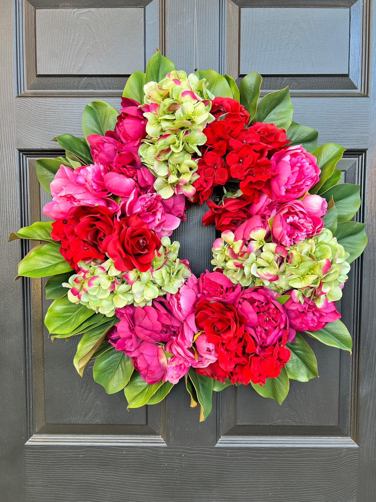 Pink, green, and red floral wreath