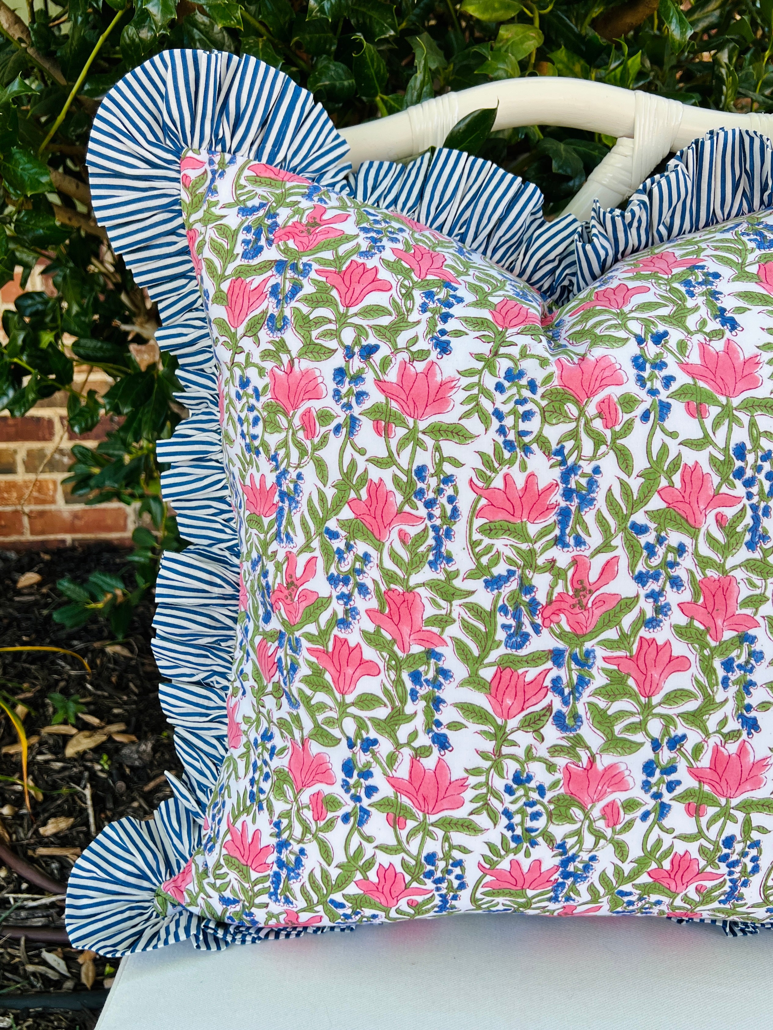 Blue, pink, and green floral pillow cover