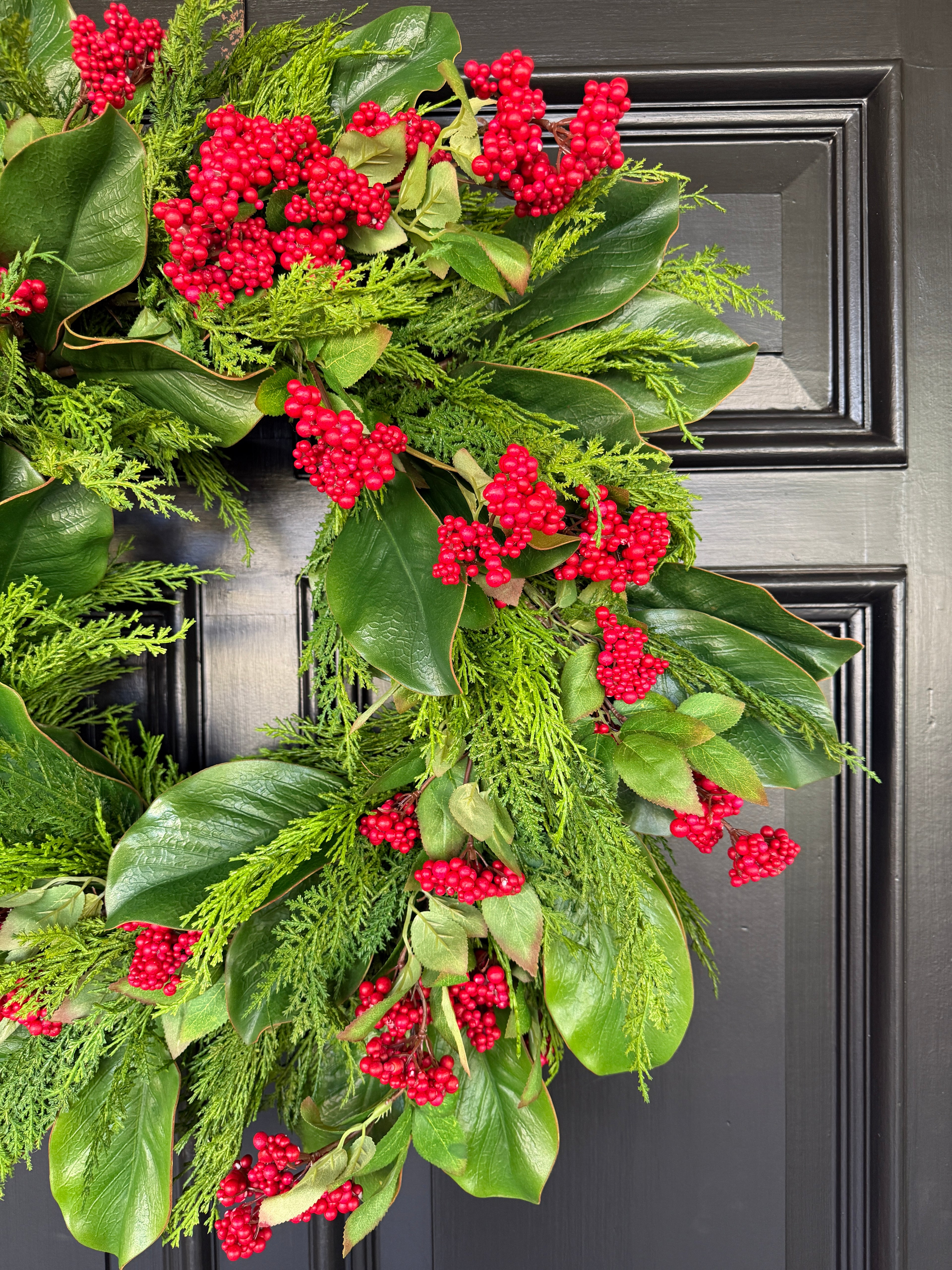 Red berry, cedar, and magnolia leaf wreath 27”