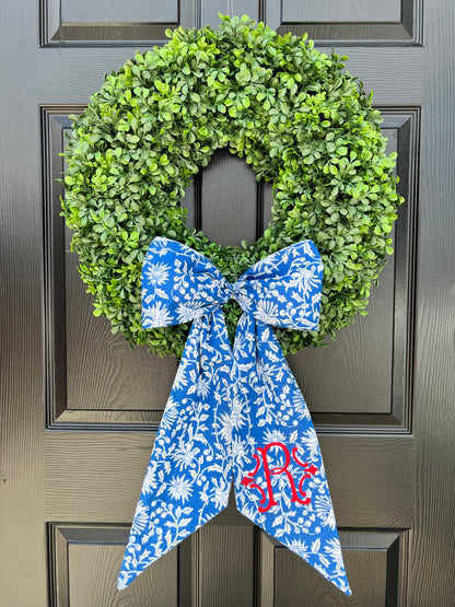 Blue and white block print wreath sash with contrast striped piping, monogram available