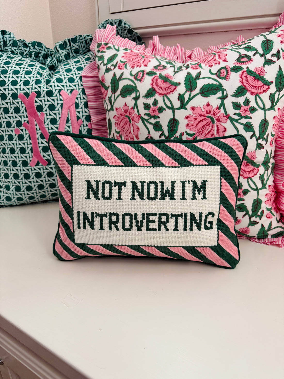 Needlepoint pillow, pink and green Introverting