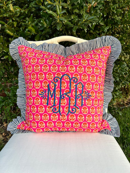 Pink and blue block print throw pillow cover with striped ruffle trim