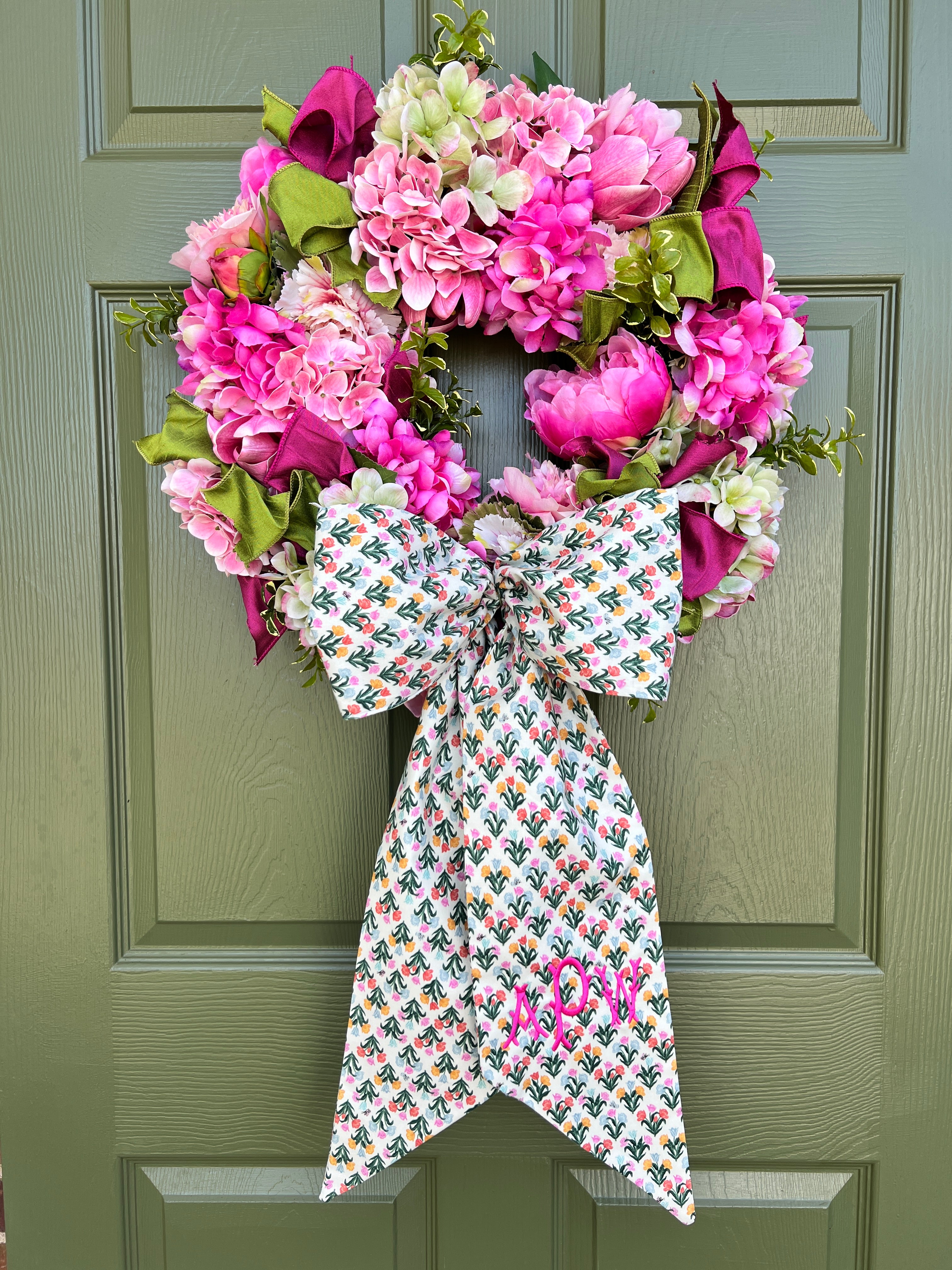 Spring pink and green hydrangea, peony, and cabbage wreath
