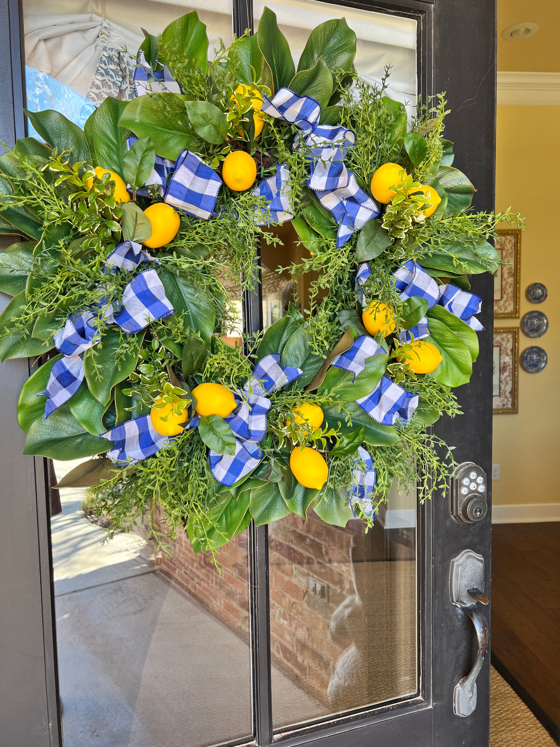 Lemon, herb, and magnolia wreath with blue gingham dupioni ribbon