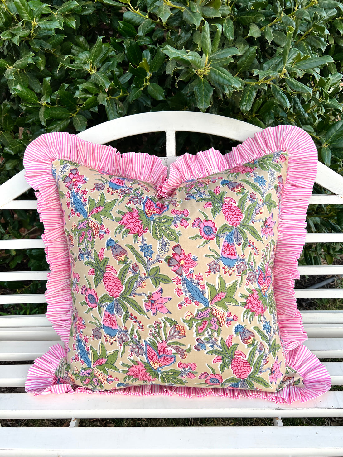 Beige, pink, green, and blue floral ruffle pillow cover
