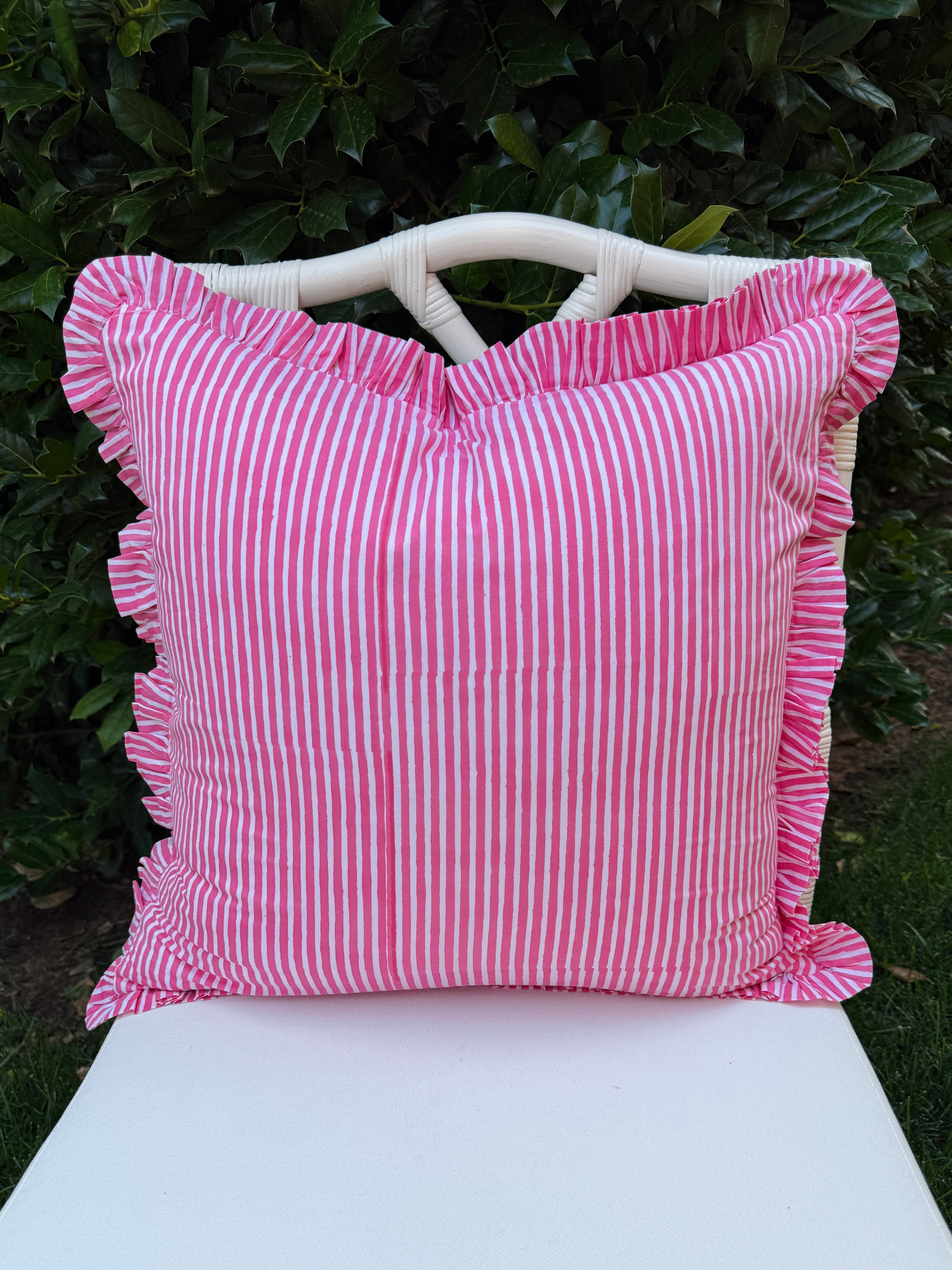 Pink and green floral trellis block print ruffle pillow cover with pink striped trim and back