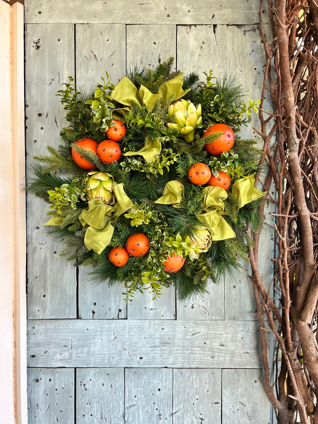 Orange pomander and artichoke wreath