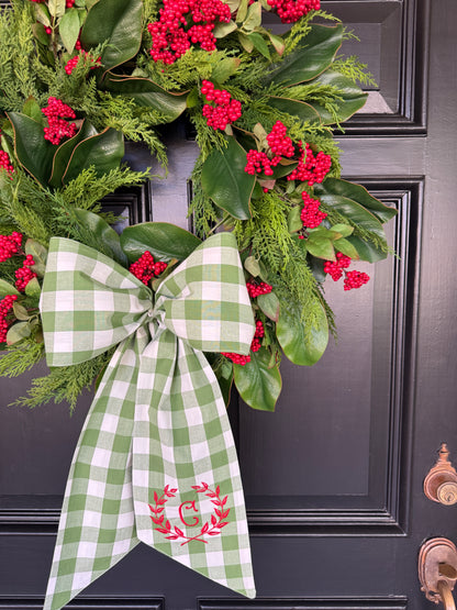 Red berry, cedar, and magnolia leaf wreath 27”