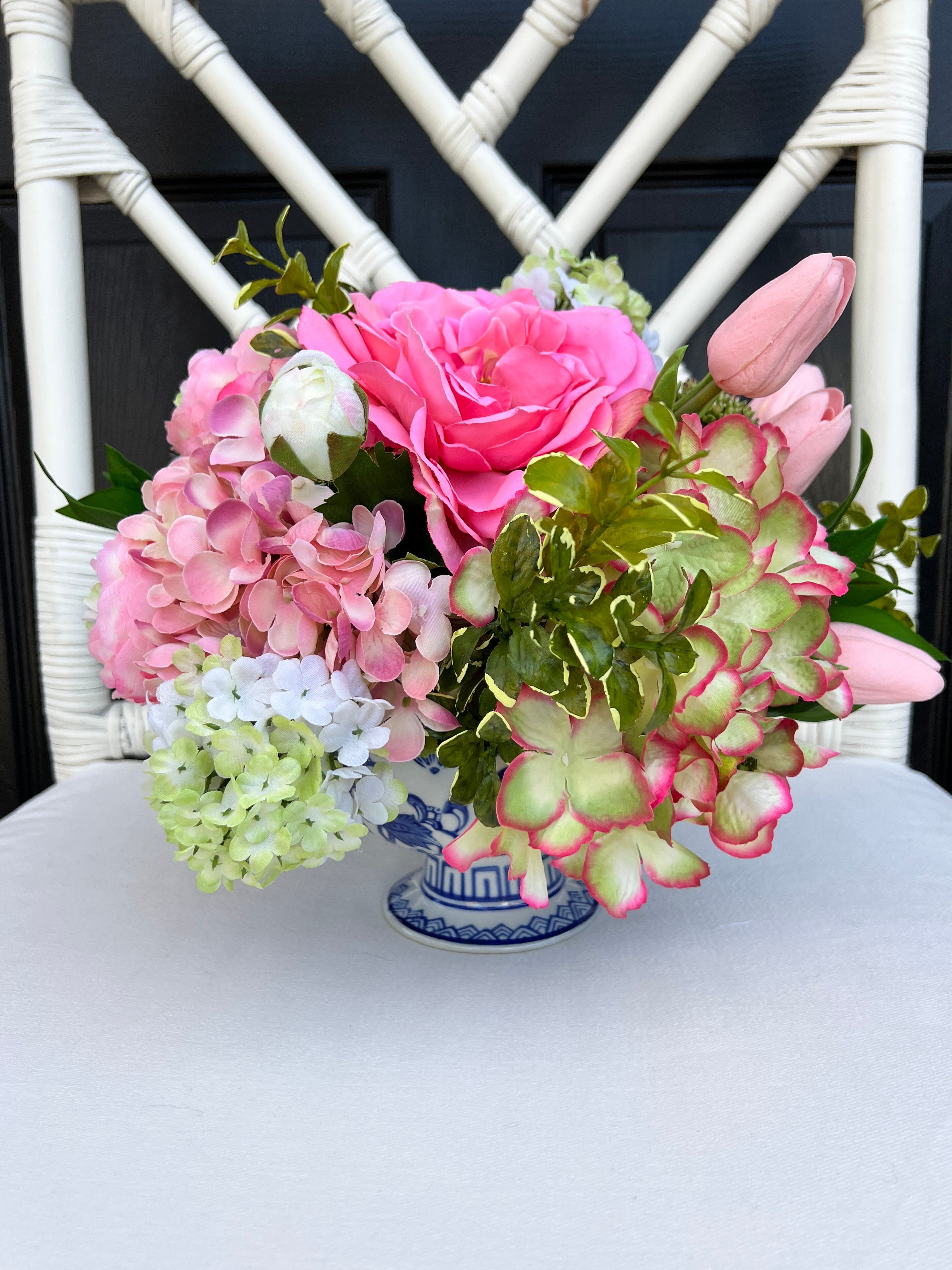 Pink and green Spring floral arrangement in chinoiserie footed bowl