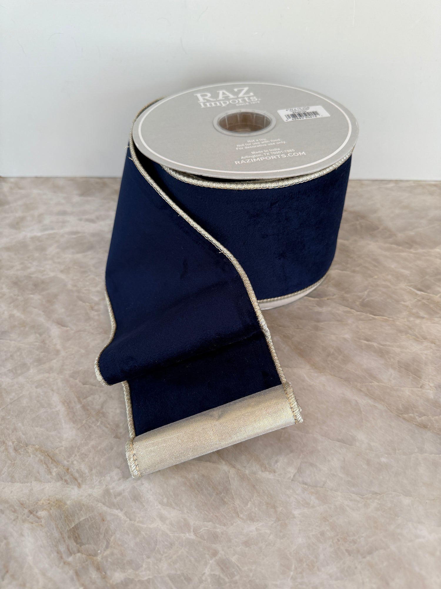 Navy velvet ribbon with gold backing, 4” wide x 10 yards