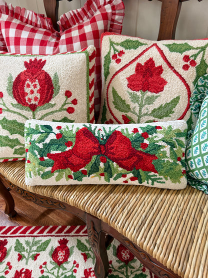 Red bow and greenery hand hooked lumbar pillow