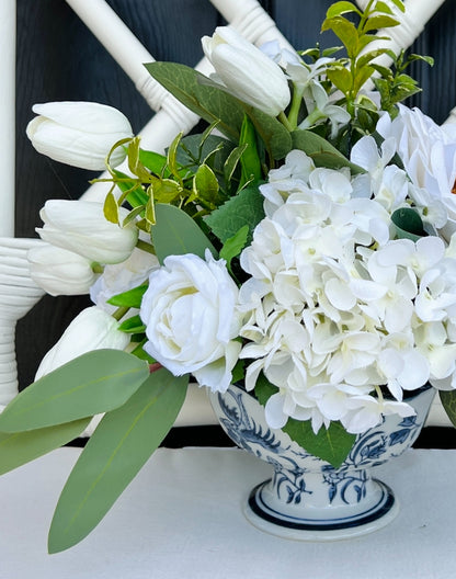 White rose and tulip floral arrangement in chinoiserie footed bowl