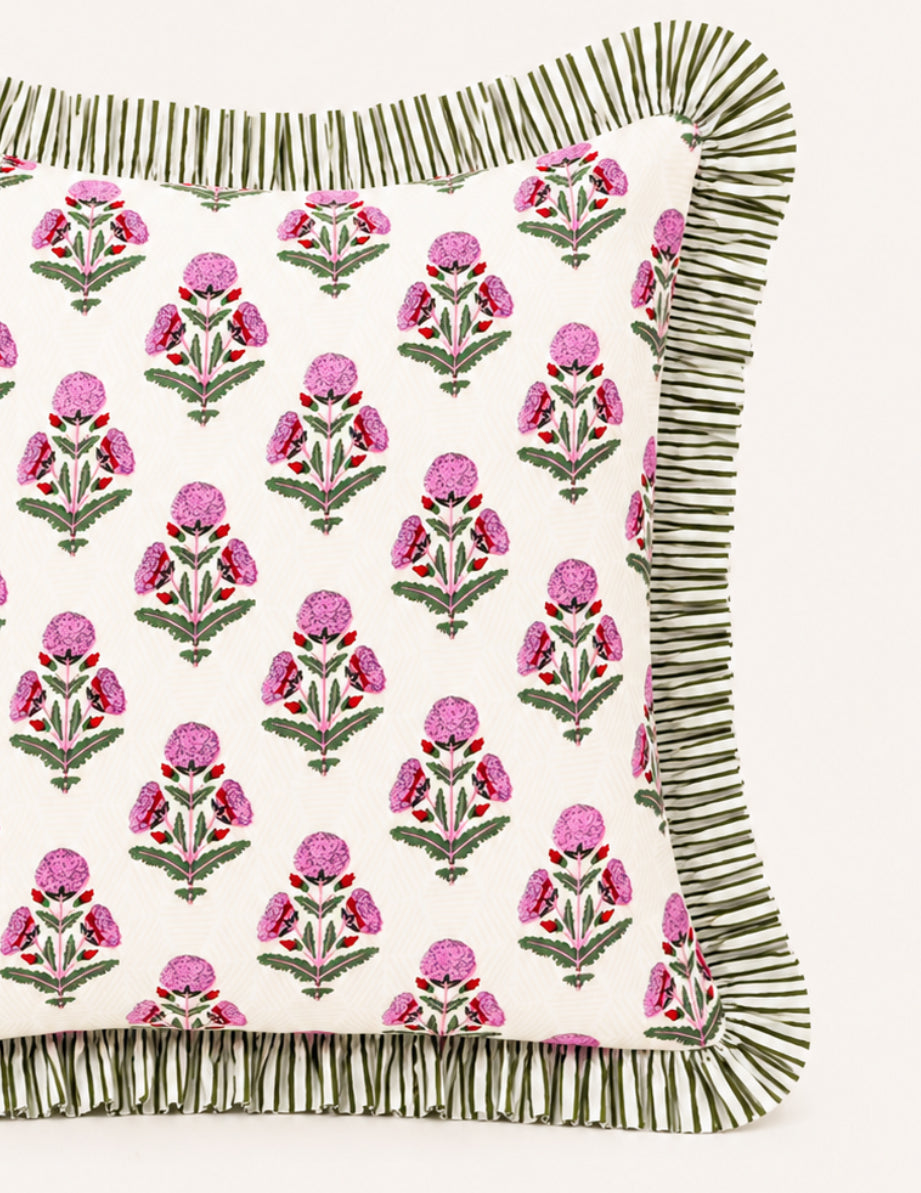 Pink and red marigold pillow cover with green striped ruffle