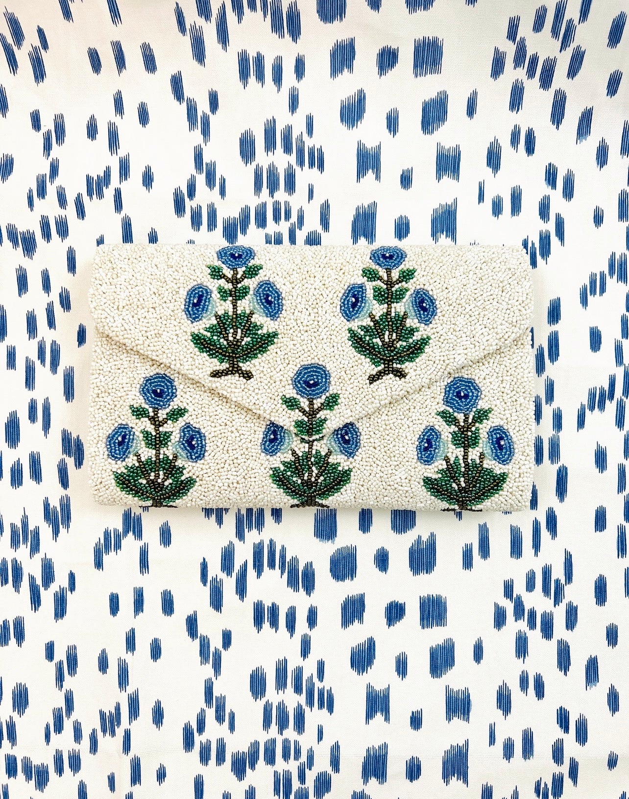 Hand beaded floral clutch in periwinkle block print floral