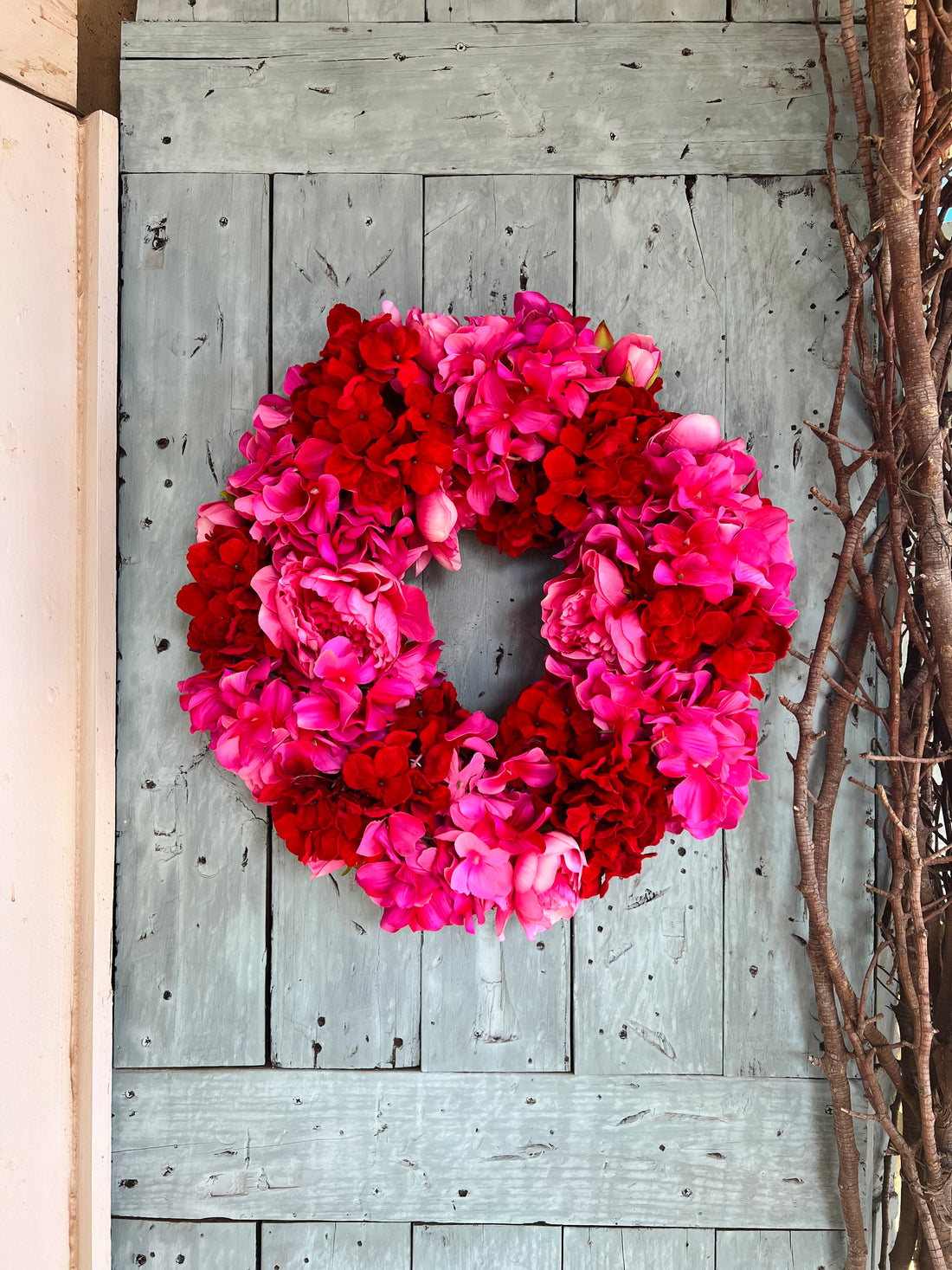 Pink and red hydrangea and peony floral wreath