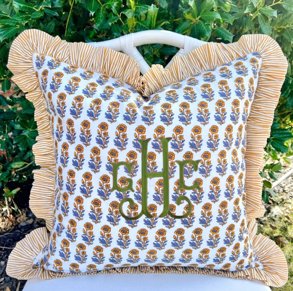 Yellow and blue block print pillow cover with striped contrast ruffle