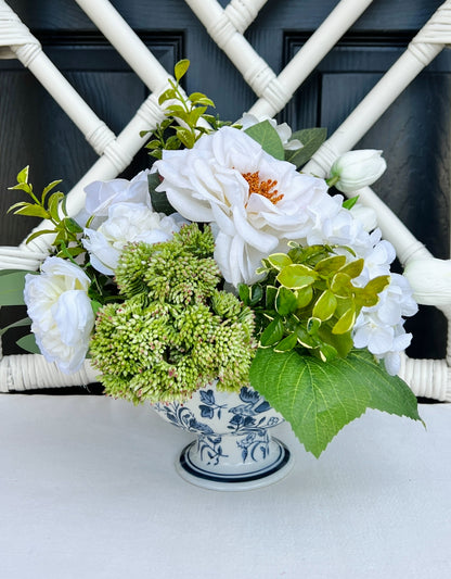 White rose and tulip floral arrangement in chinoiserie footed bowl