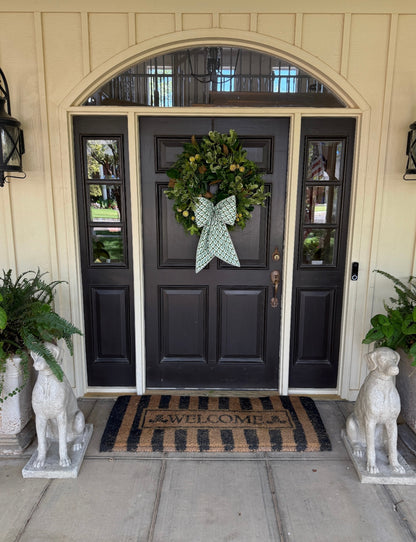 Green block print wreath sash with striped piping