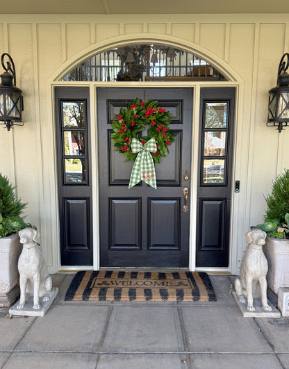 Red berry, cedar, and magnolia leaf wreath 27”