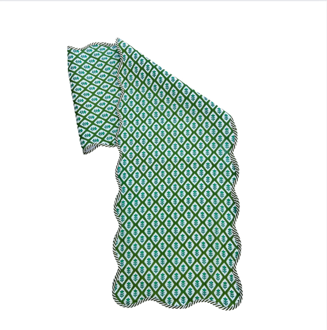 Green block print scalloped table runner with contrast piping