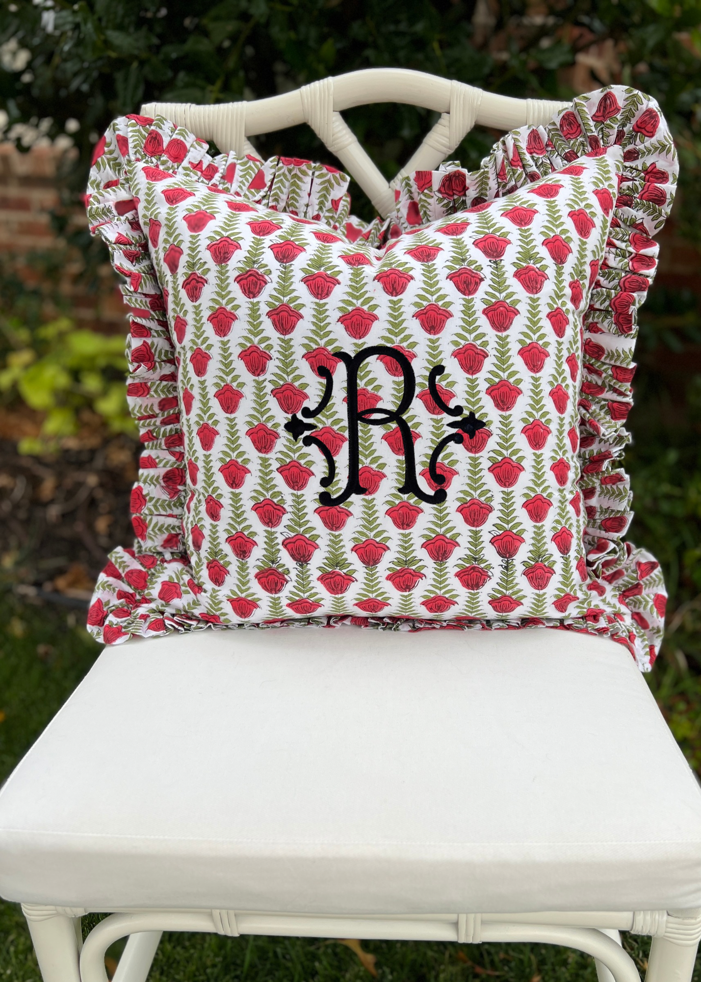 Red and green block print pillow cover with ruffle trim