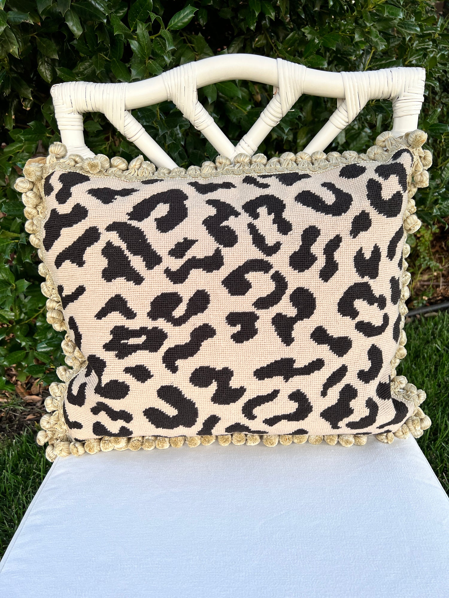 Beige and black leopard needlepoint throw pillow