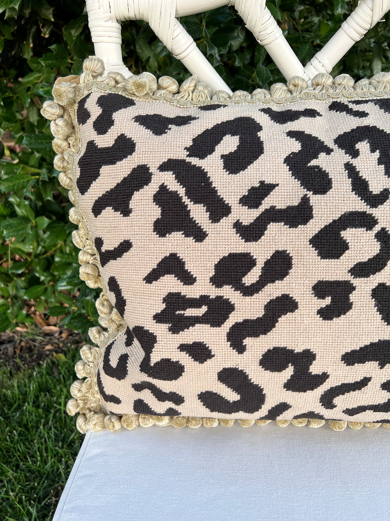 Beige and black leopard needlepoint throw pillow