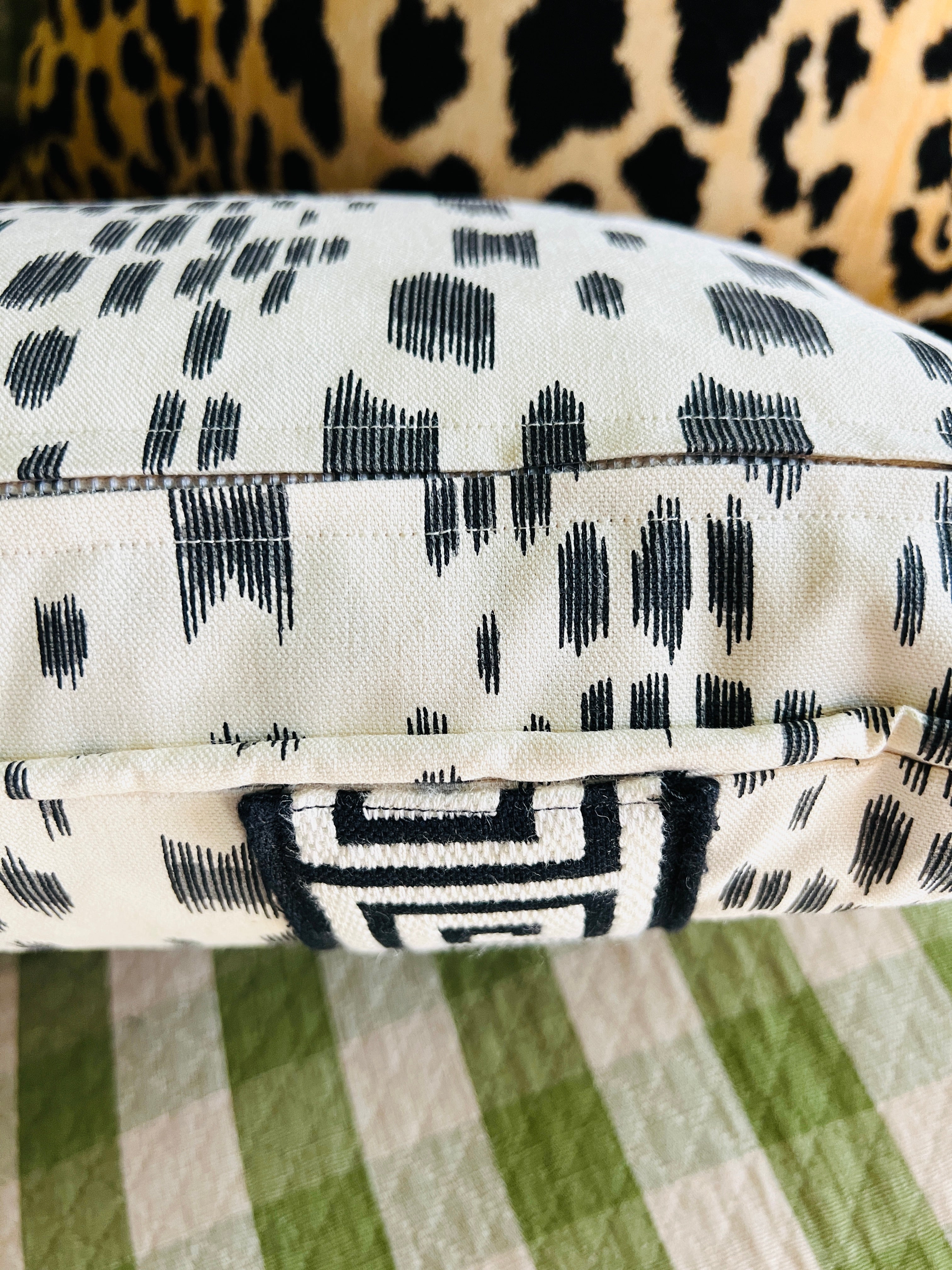 Les Touches black and cream spotted throw pillow cover with Greek key tape trim