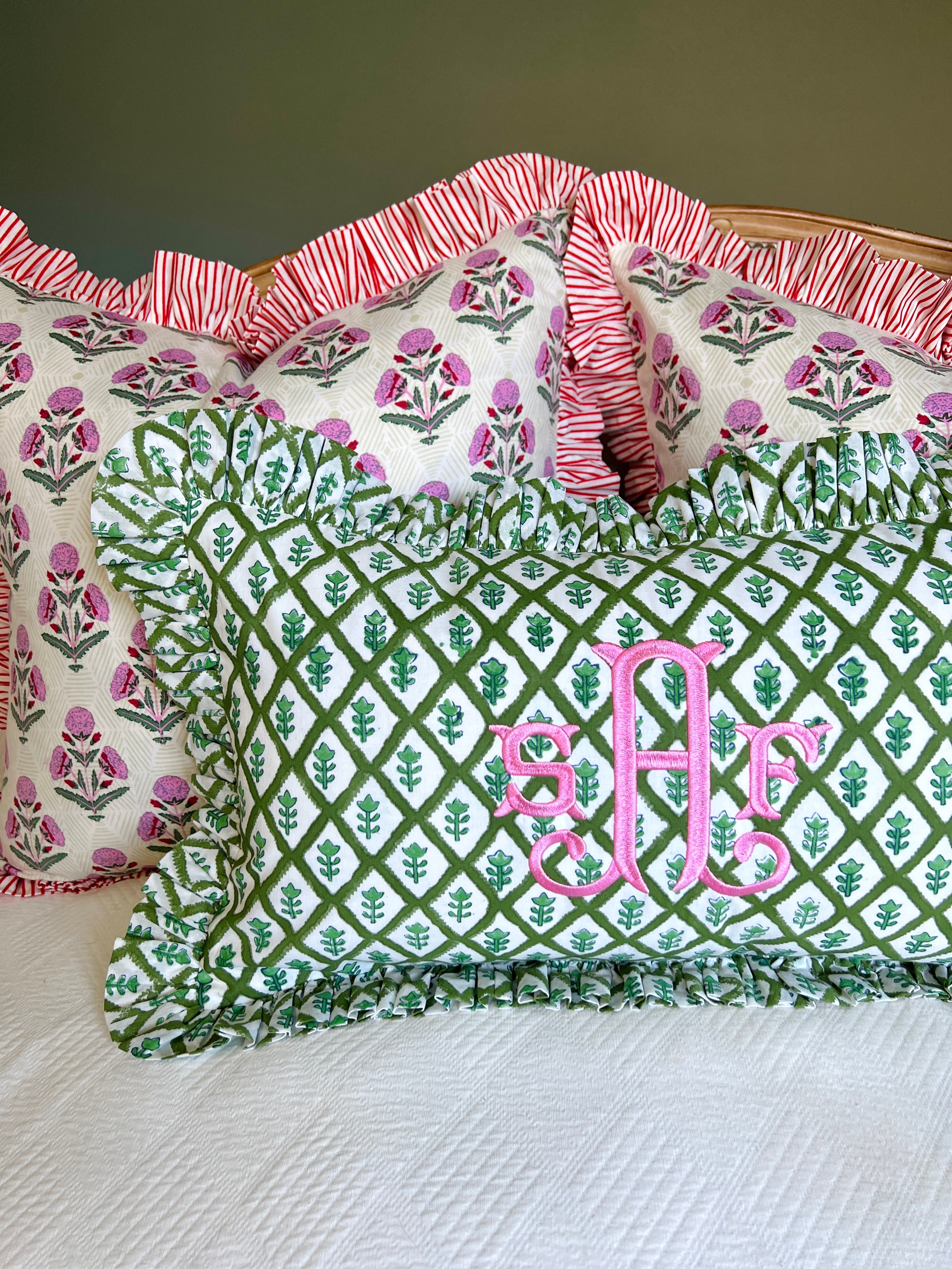 Pink and red floral block print ruffle pillow