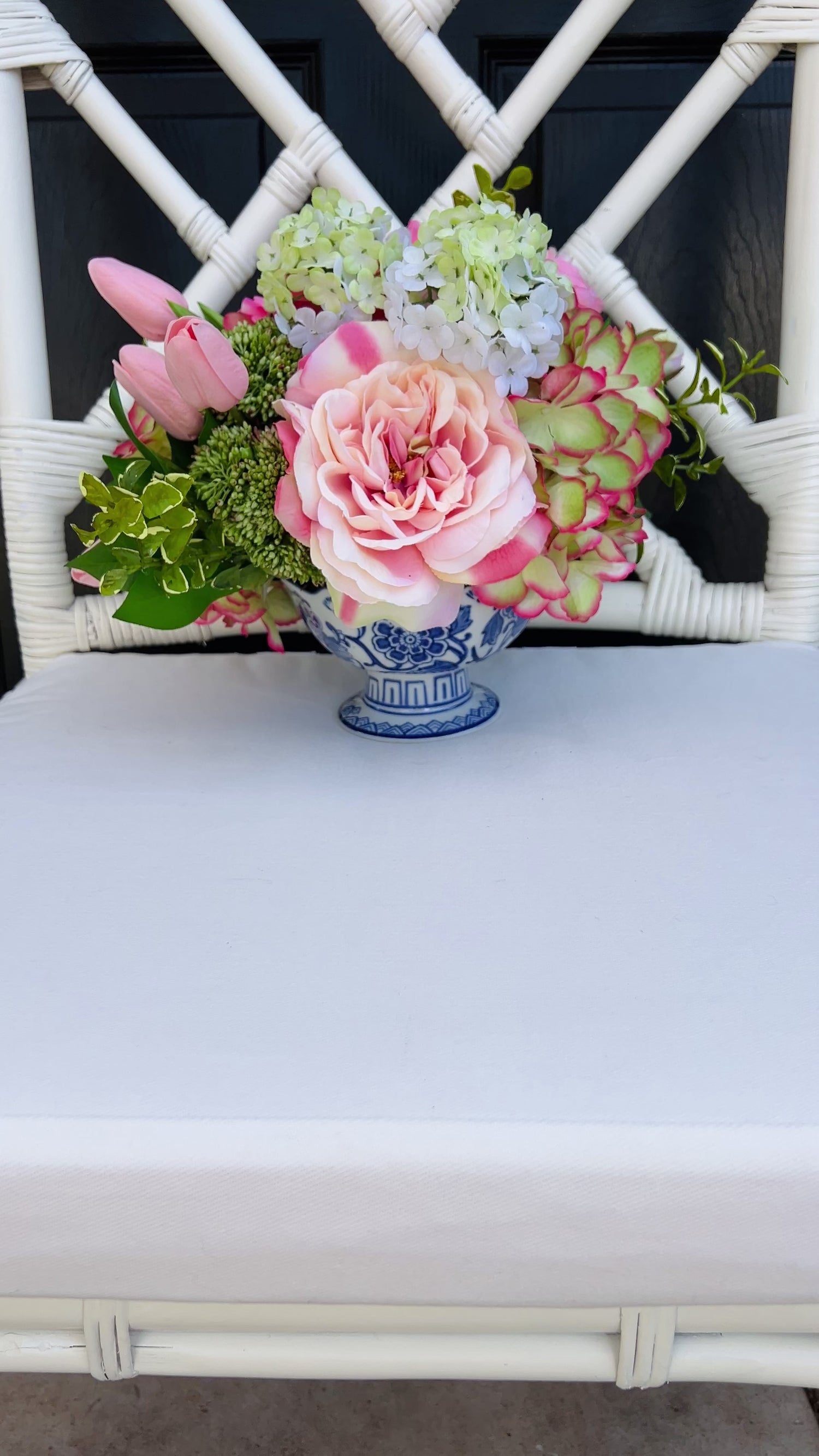 Pink and green Spring floral arrangement in chinoiserie footed bowl