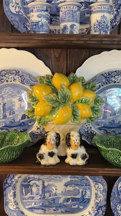 Mini black porcelain Staffordshire dogs with flower baskets figurine pair